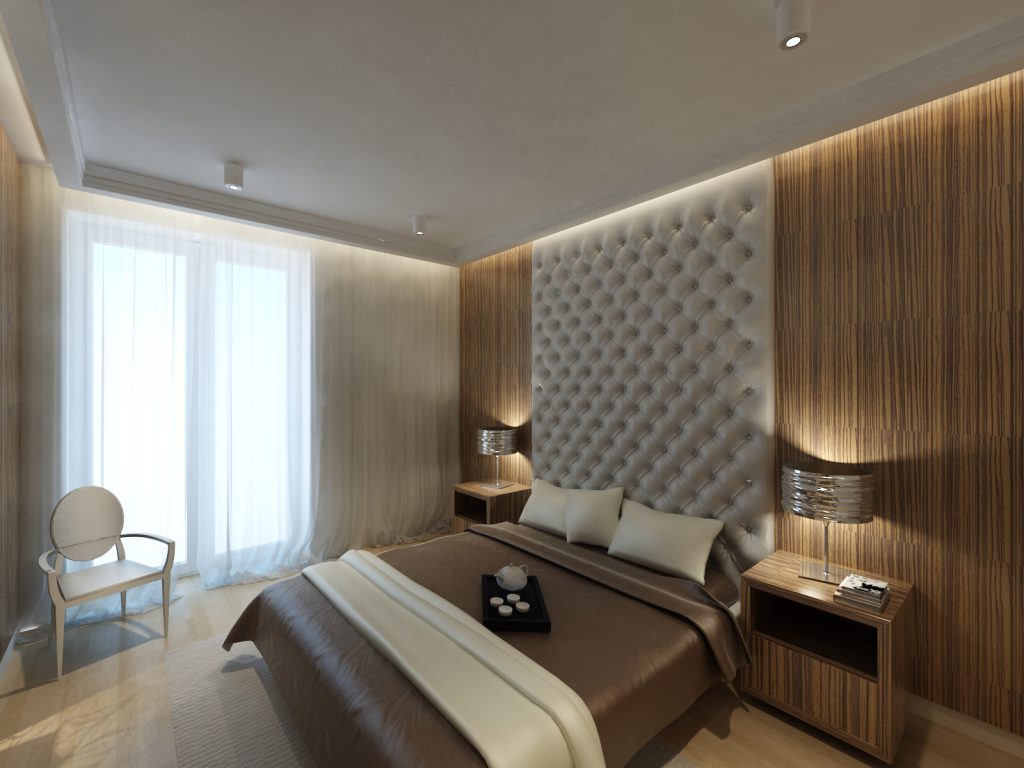 Sypialnia z tapicerowaną ścianą białą szarą tkaniną obiciową, która pełnie funkcję zagłowia łóżka